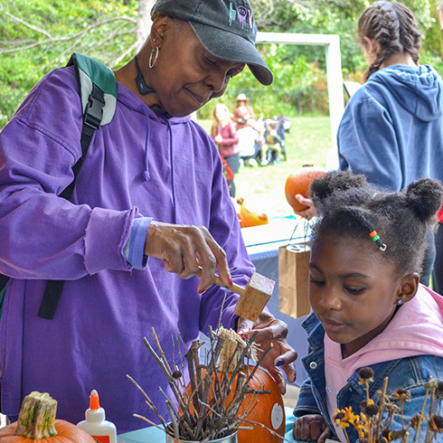 Mother and child with pumpkin crafts